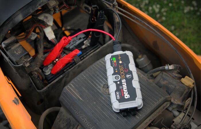 can you charge a tractor battery without disconnecting it